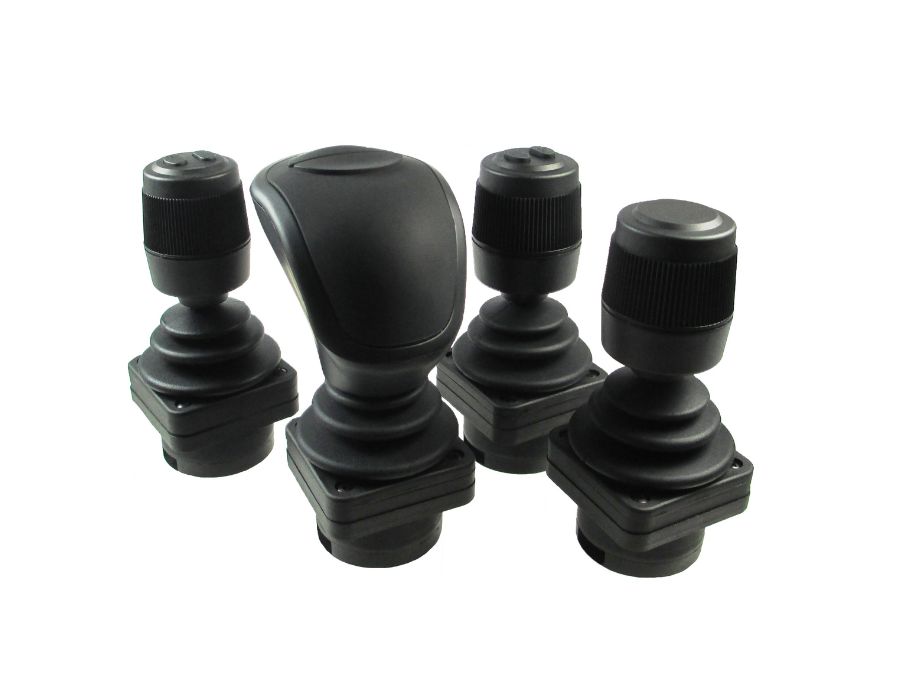 Set of black industrial joystick controllers.