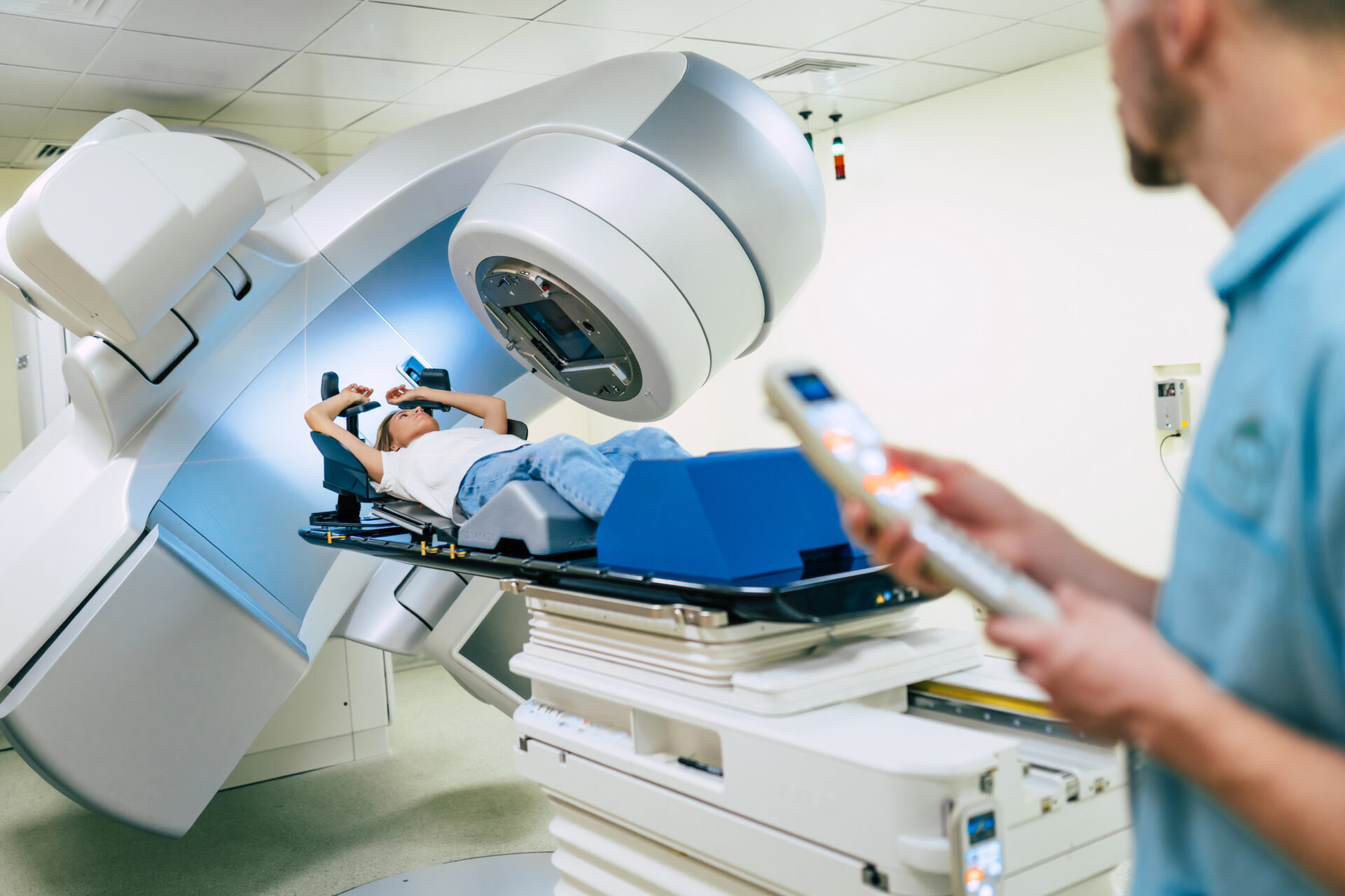 photo of a doctor controlling a medical machine by remote control