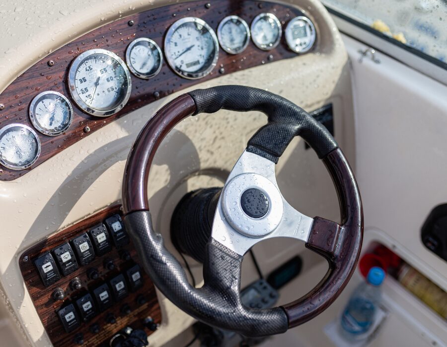 Wet boat steering wheel and control panel.