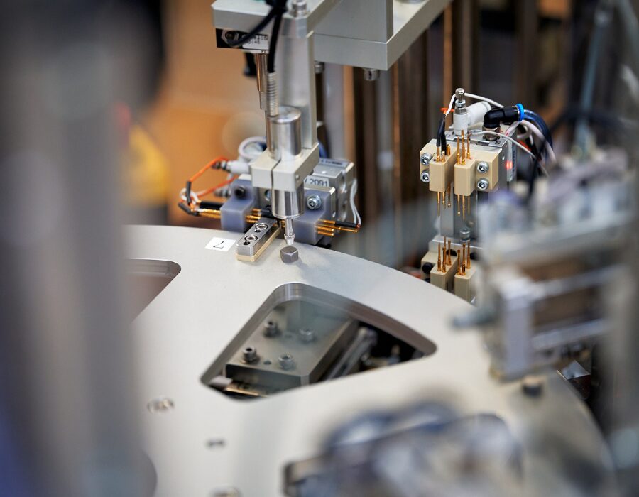 Close-up of automated machinery in a manufacturing process.