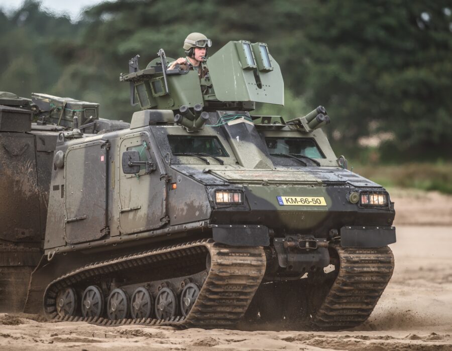 Military tank on a dirt terrain